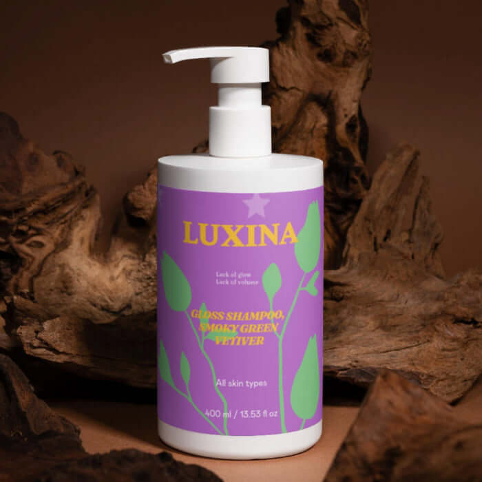 Luxina bottle with purple label against a brown background