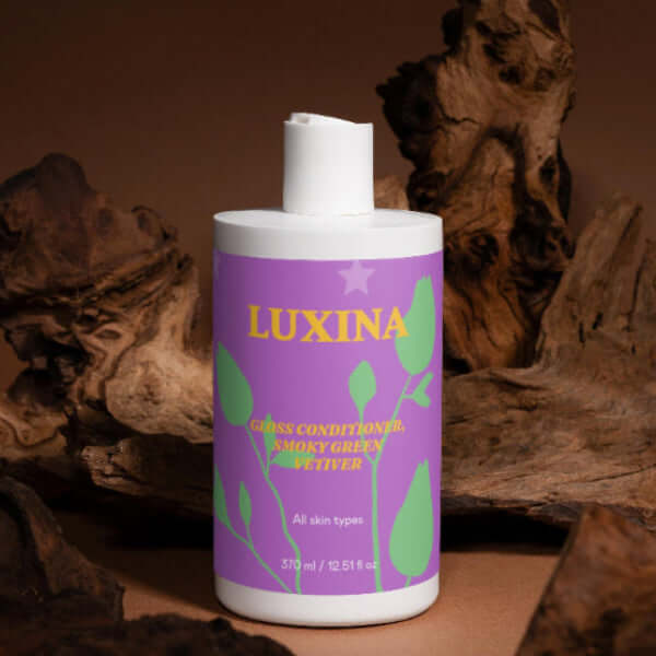 Luxina bottle with purple label against a brown background